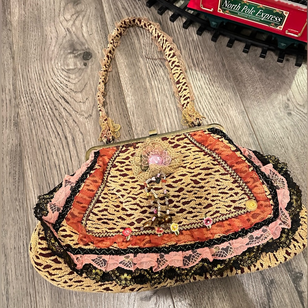 Vintage style purse. Lots of detail and color.